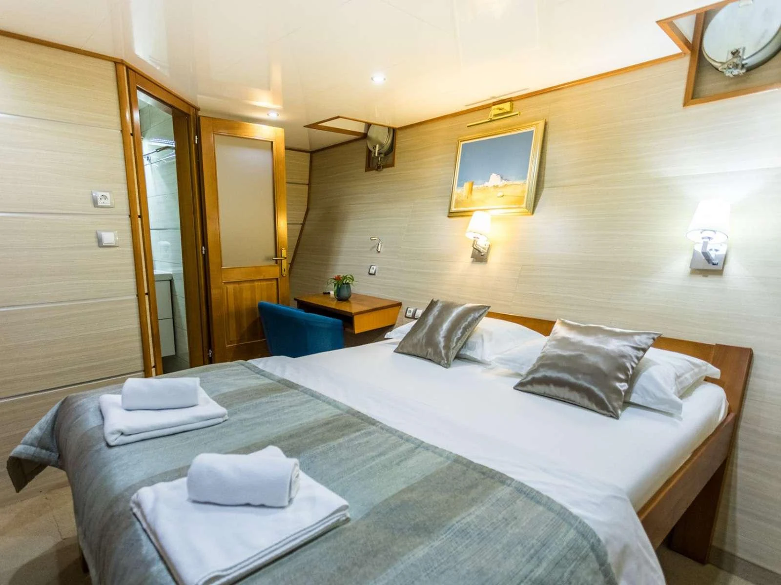 a hotel room with a bed aboard KARIZMA Yacht for Charter