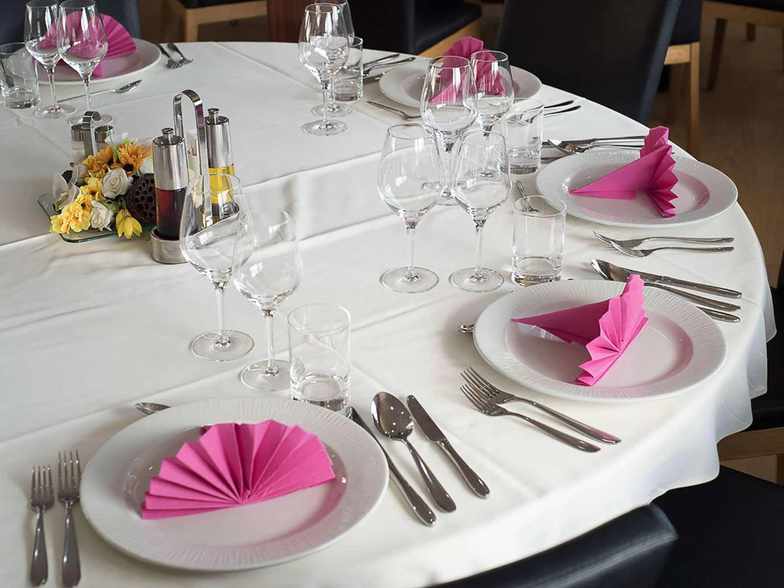 a table with plates and glasses aboard KARIZMA Yacht for Charter