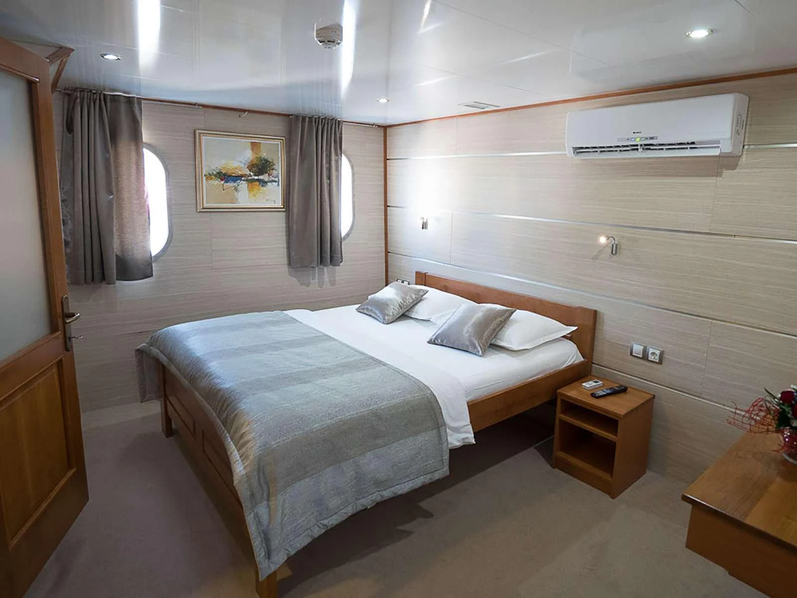 a bed in a room aboard KARIZMA Yacht for Charter
