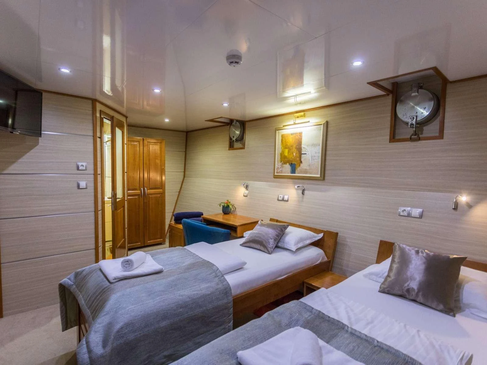 a room with two beds aboard KARIZMA Yacht for Charter