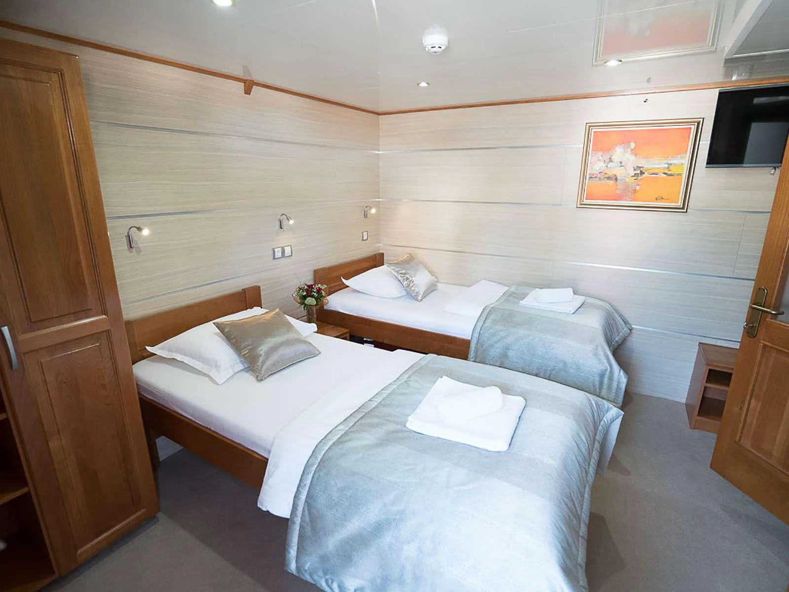 a room with two beds aboard KARIZMA Yacht for Charter
