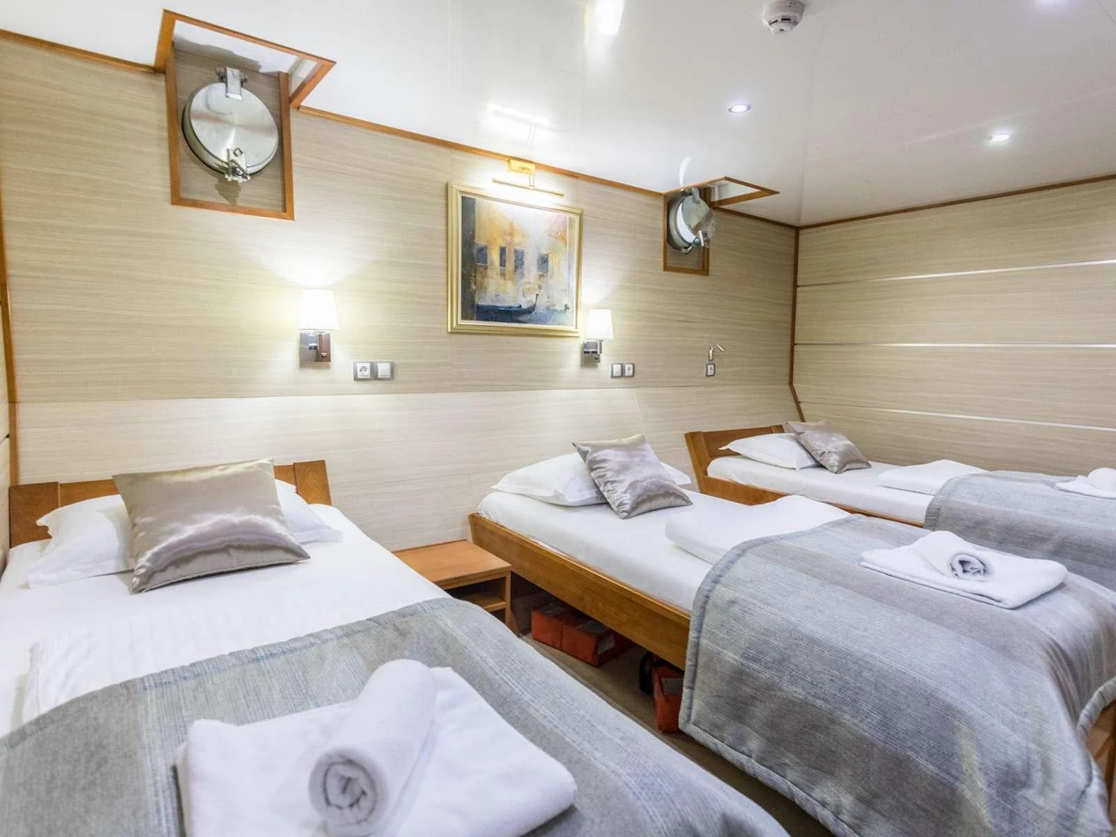 a room with two beds aboard KARIZMA Yacht for Charter