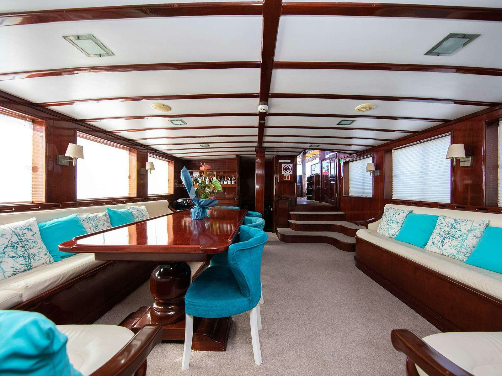 a room with a couch and a table aboard DALMATINO Yacht for Charter