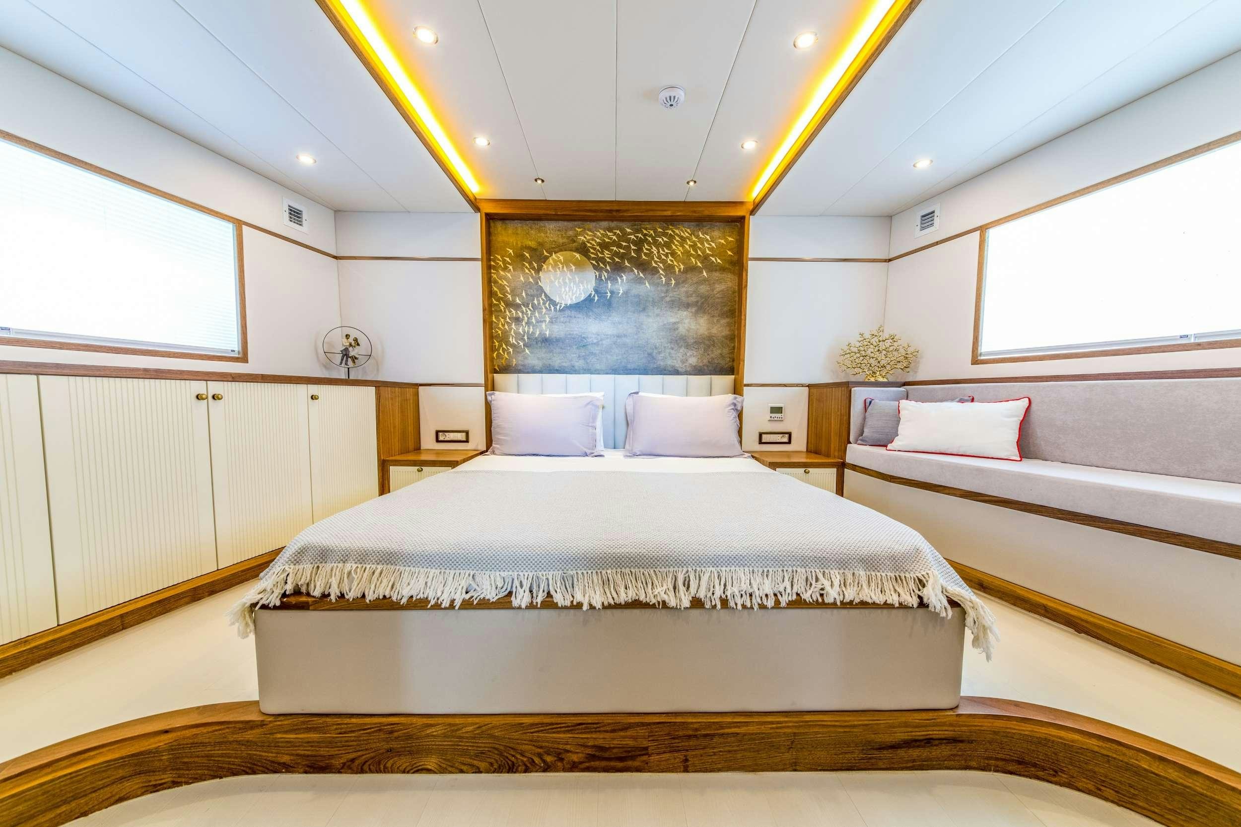 a room with two beds aboard FLOKI Yacht for Charter