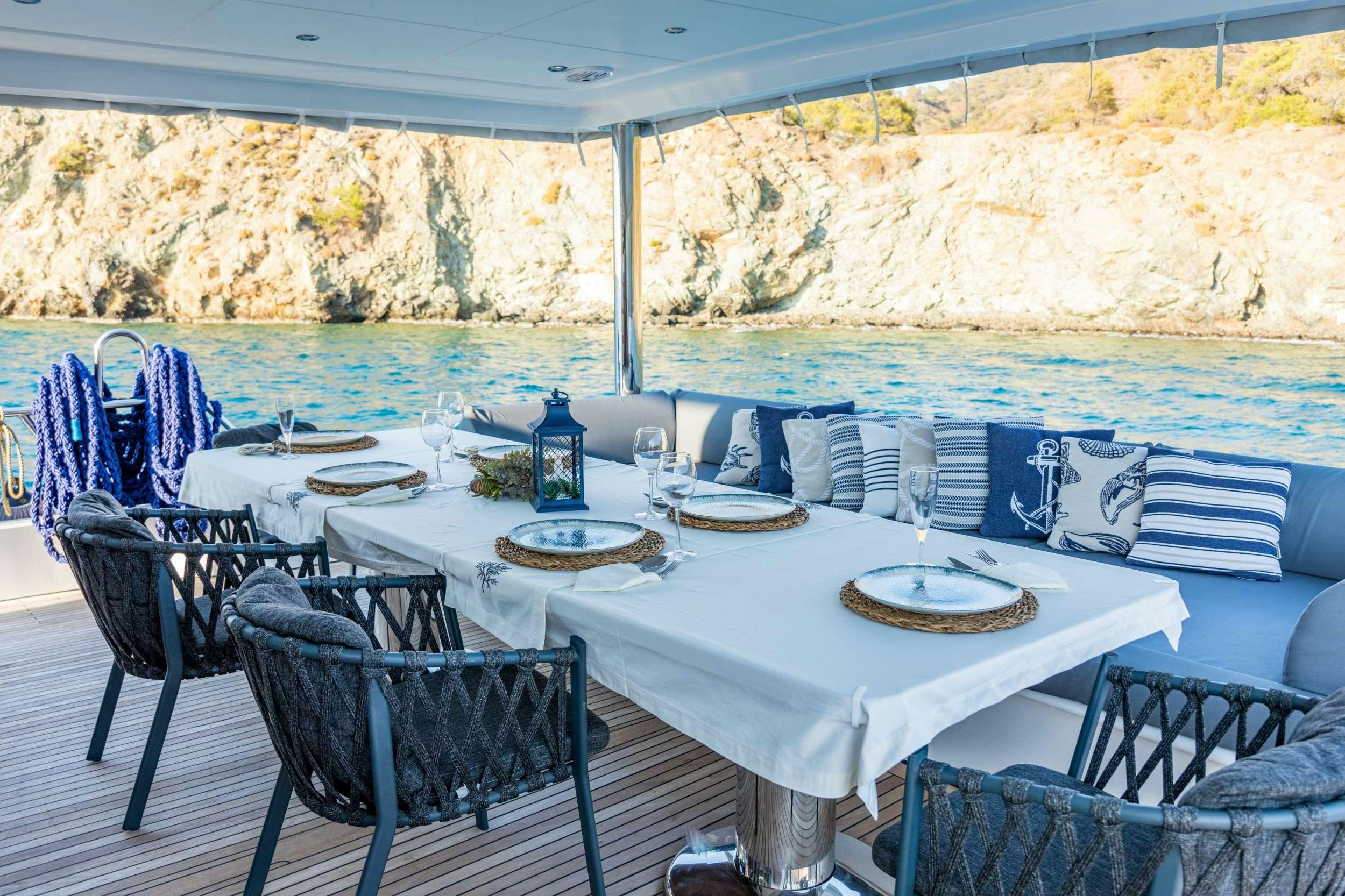 a table set for a meal aboard FLOKI Yacht for Charter