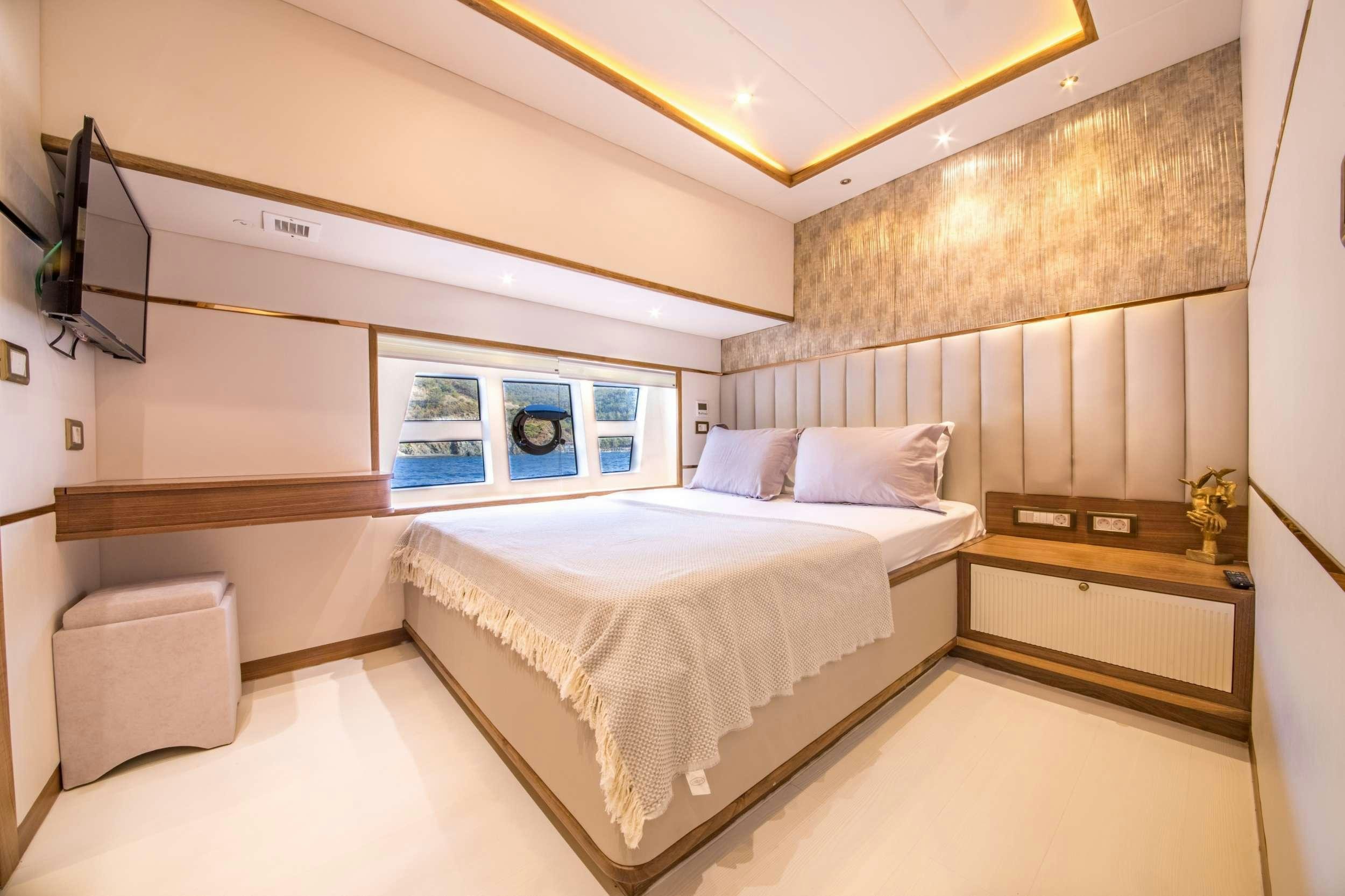 a bed in a room aboard FLOKI Yacht for Charter