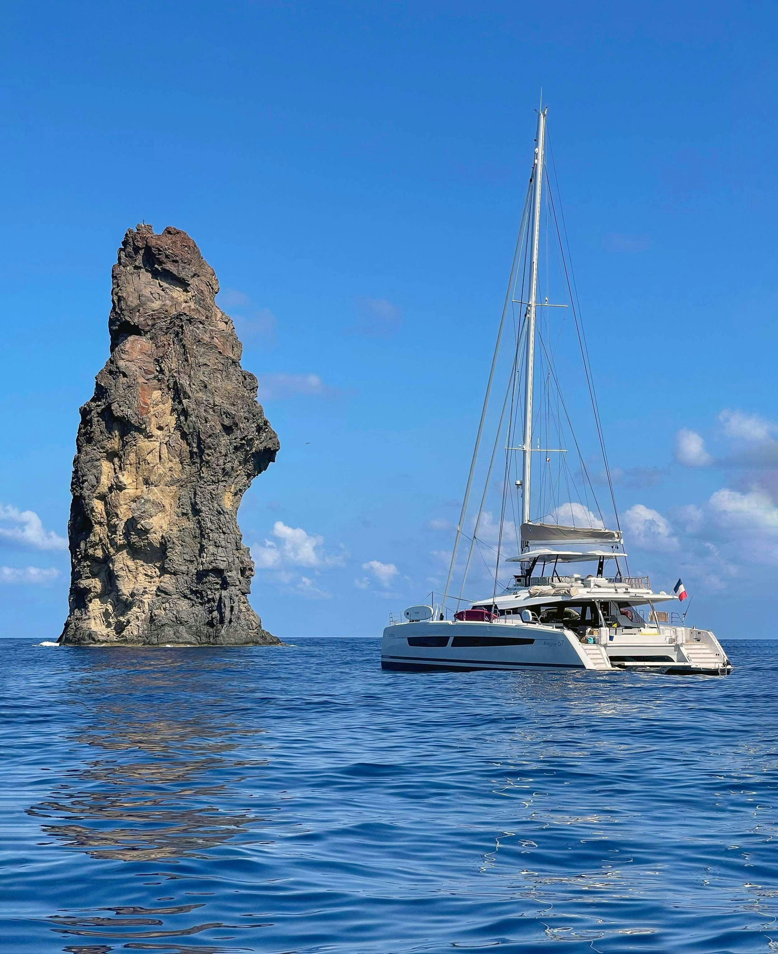 a boat sailing on the water aboard ADEONA Yacht for Charter