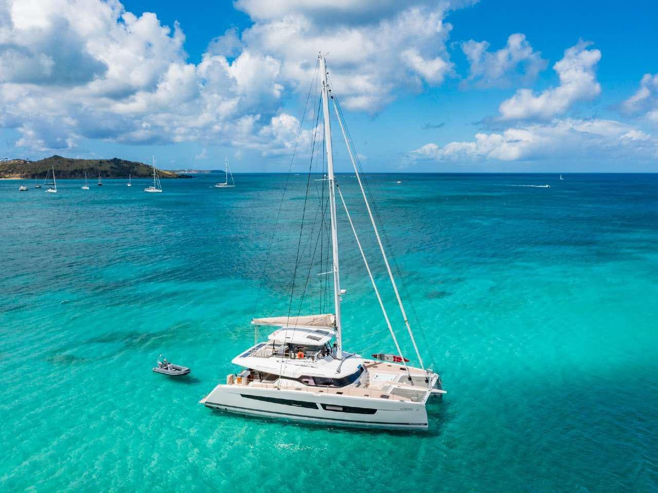 a sailboat in the water aboard ADEONA Yacht for Charter