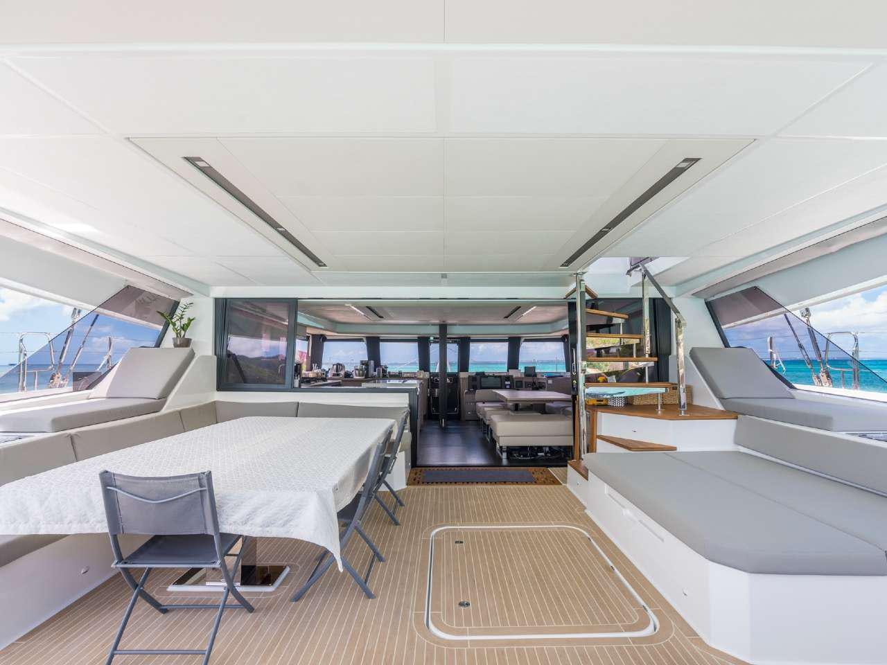 a room with a table and chairs aboard ADEONA Yacht for Charter