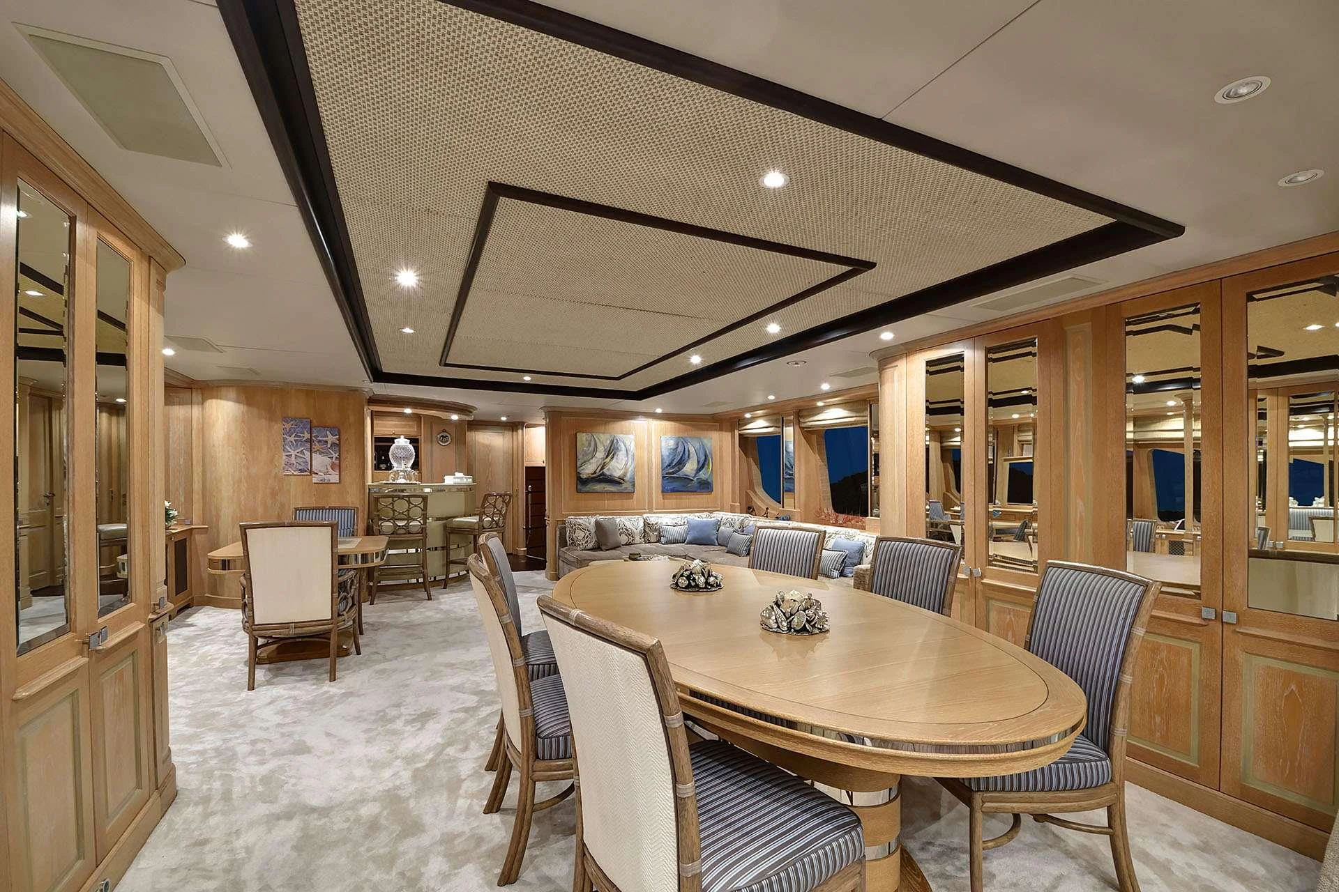 a large dining room with a large table and chairs aboard QUEST R Yacht for Charter