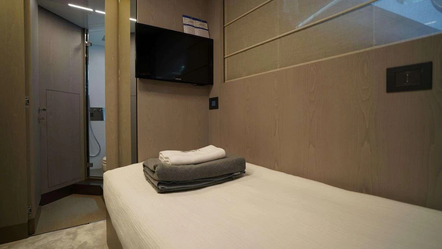 a bed in a room aboard SHERO Yacht for Charter