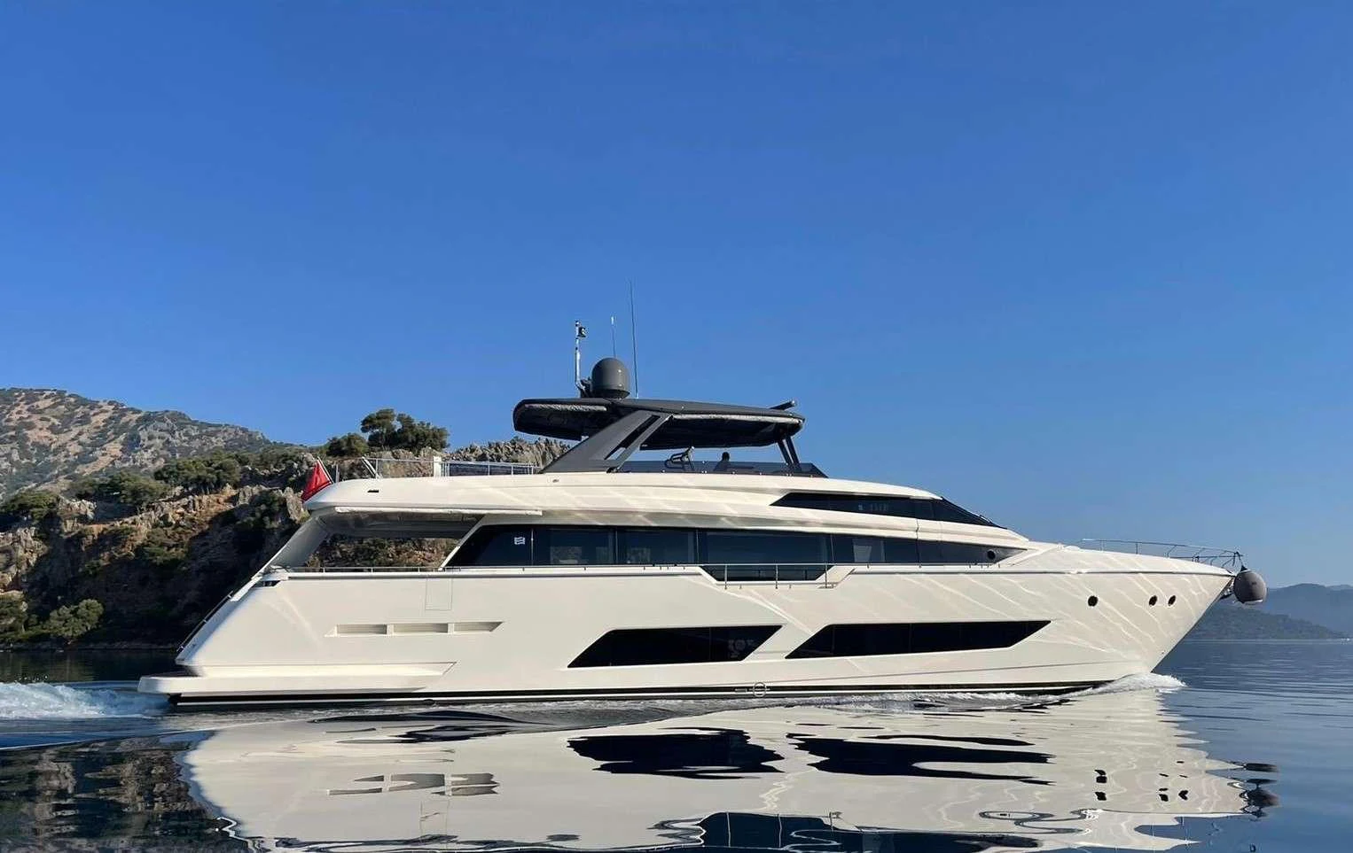 a white yacht on the water aboard SHERO Yacht for Charter