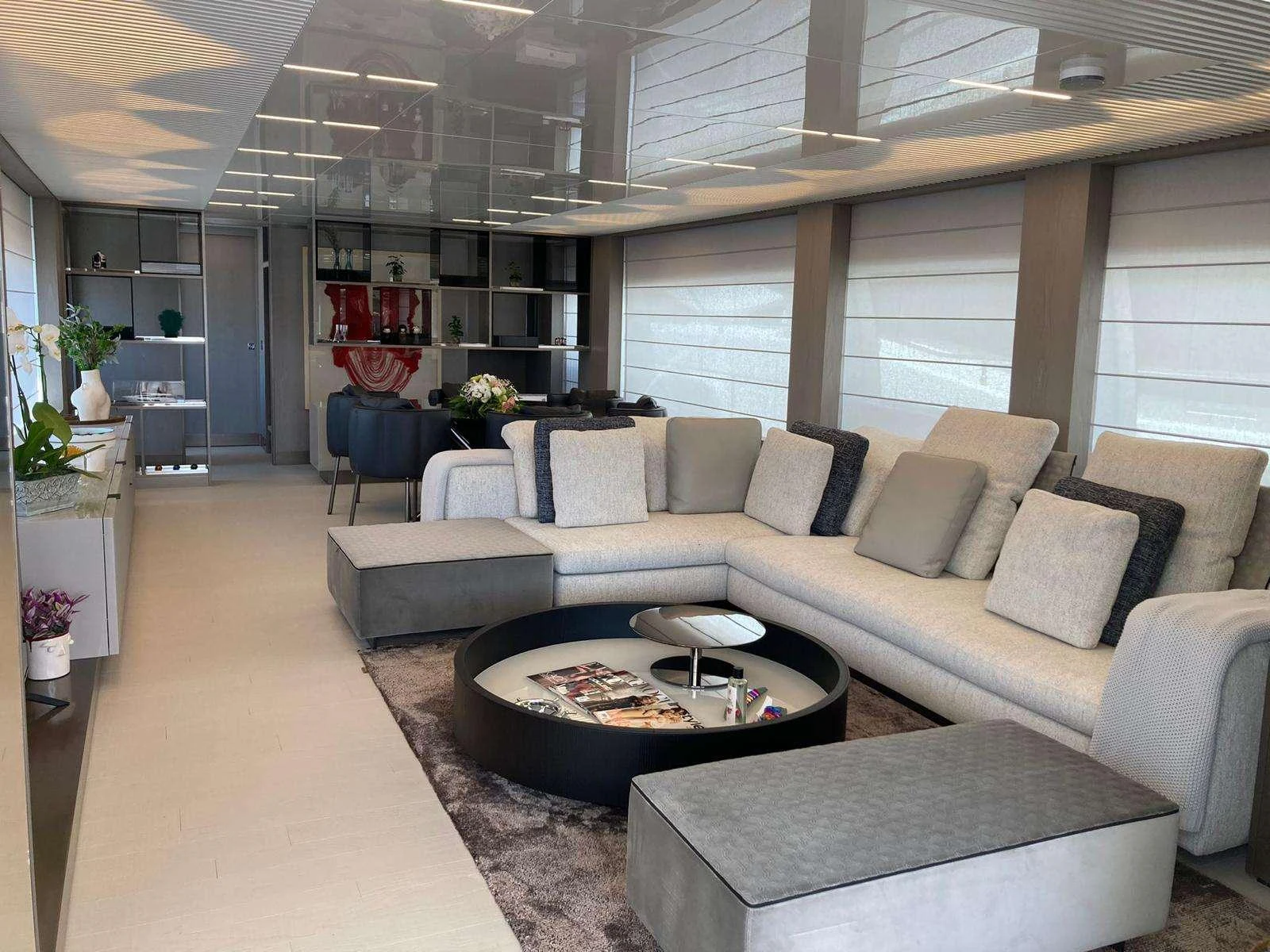 a living room with a couch and a coffee table aboard SHERO Yacht for Charter