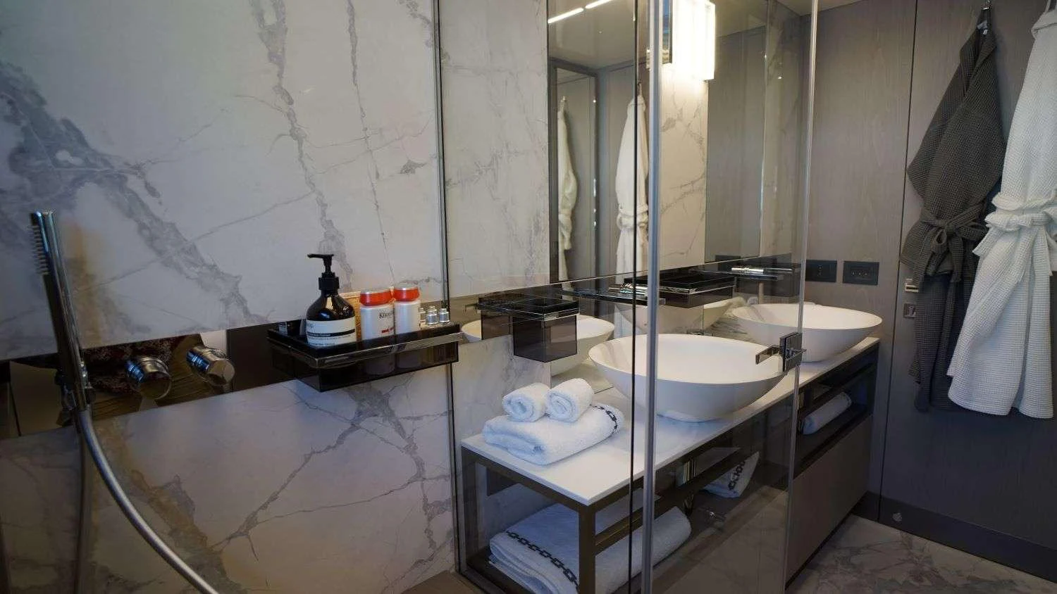 a bathroom with a sink and a mirror aboard SHERO Yacht for Charter