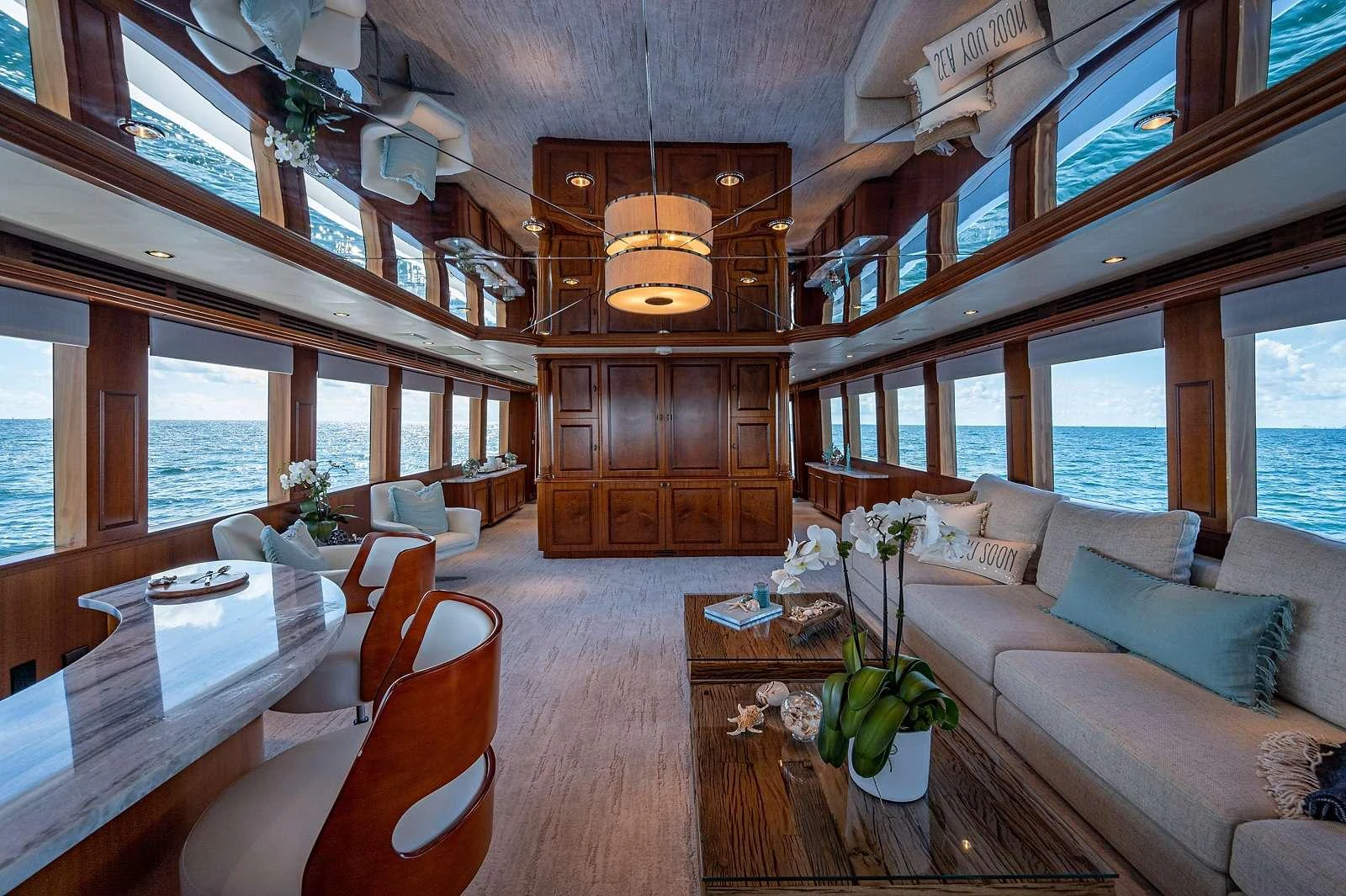 a living room with a large open ceiling aboard MAGNUM RIDE Yacht for Charter
