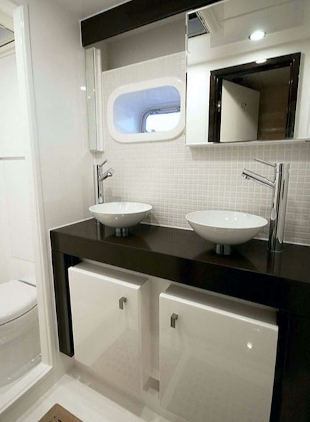 a bathroom with two sinks aboard SERENDIPITY Yacht for Charter