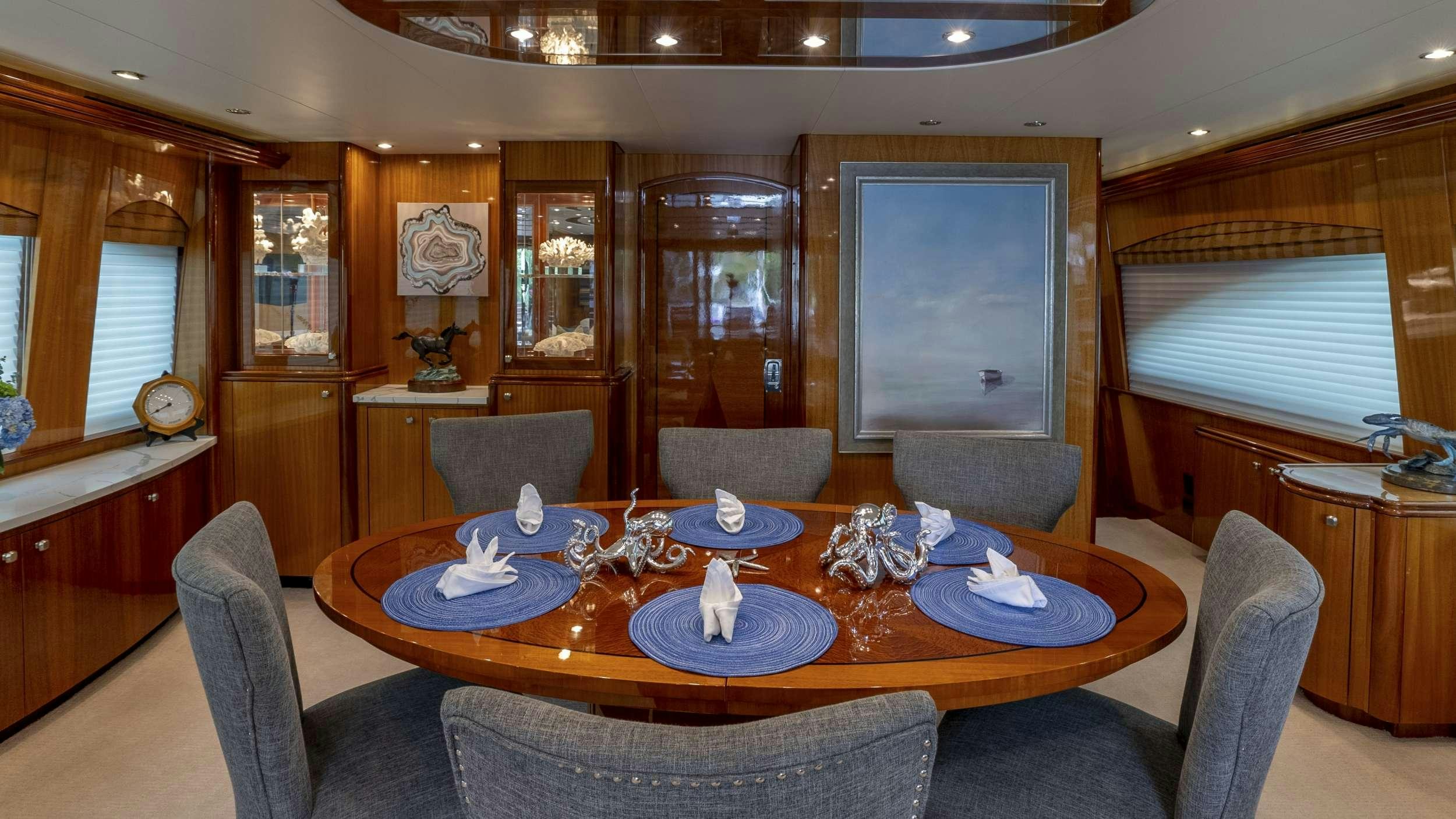 a dining room with a table aboard GALLOPIN Yacht for Charter