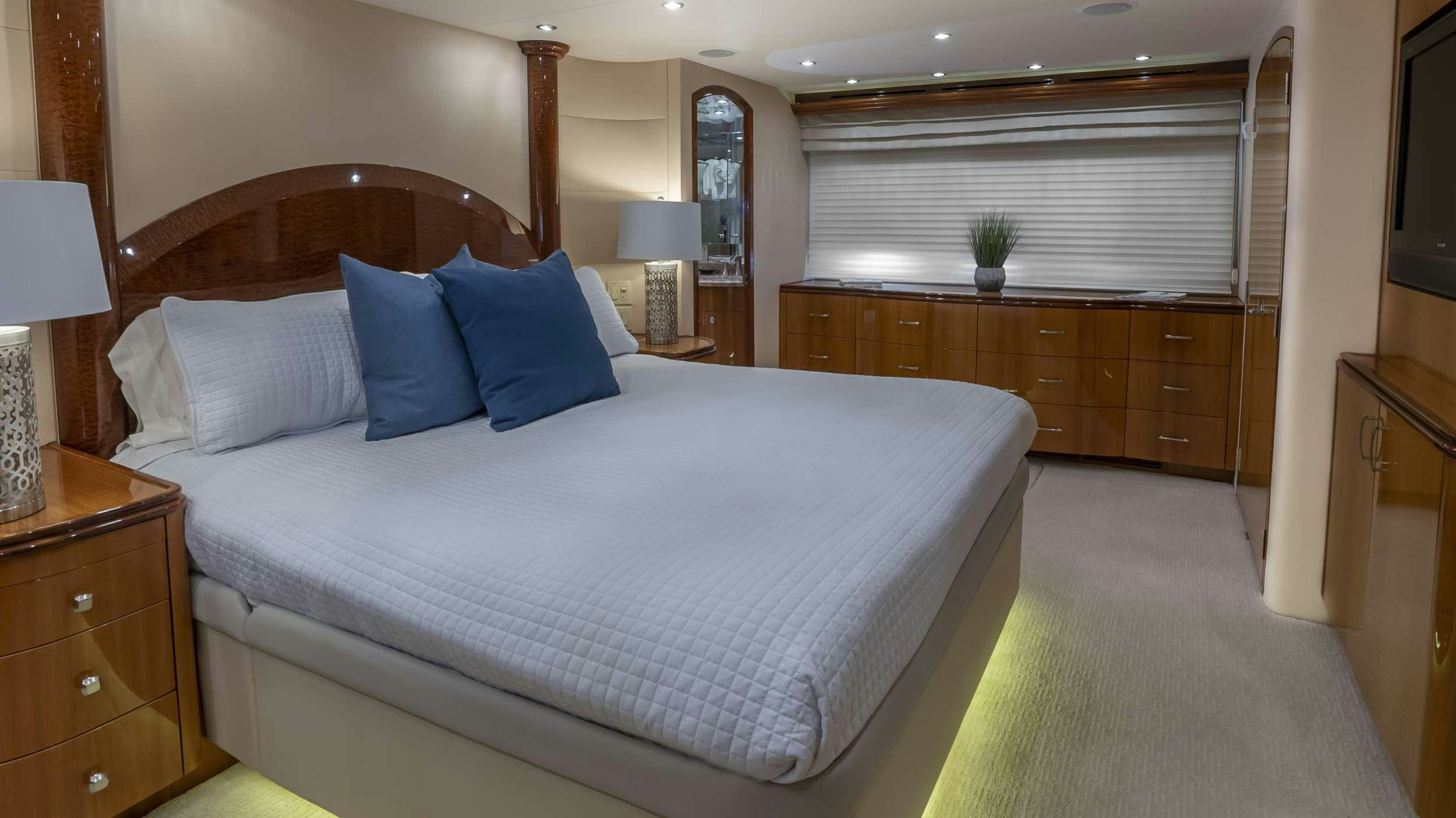 a large bed in a hotel room aboard GALLOPIN Yacht for Charter