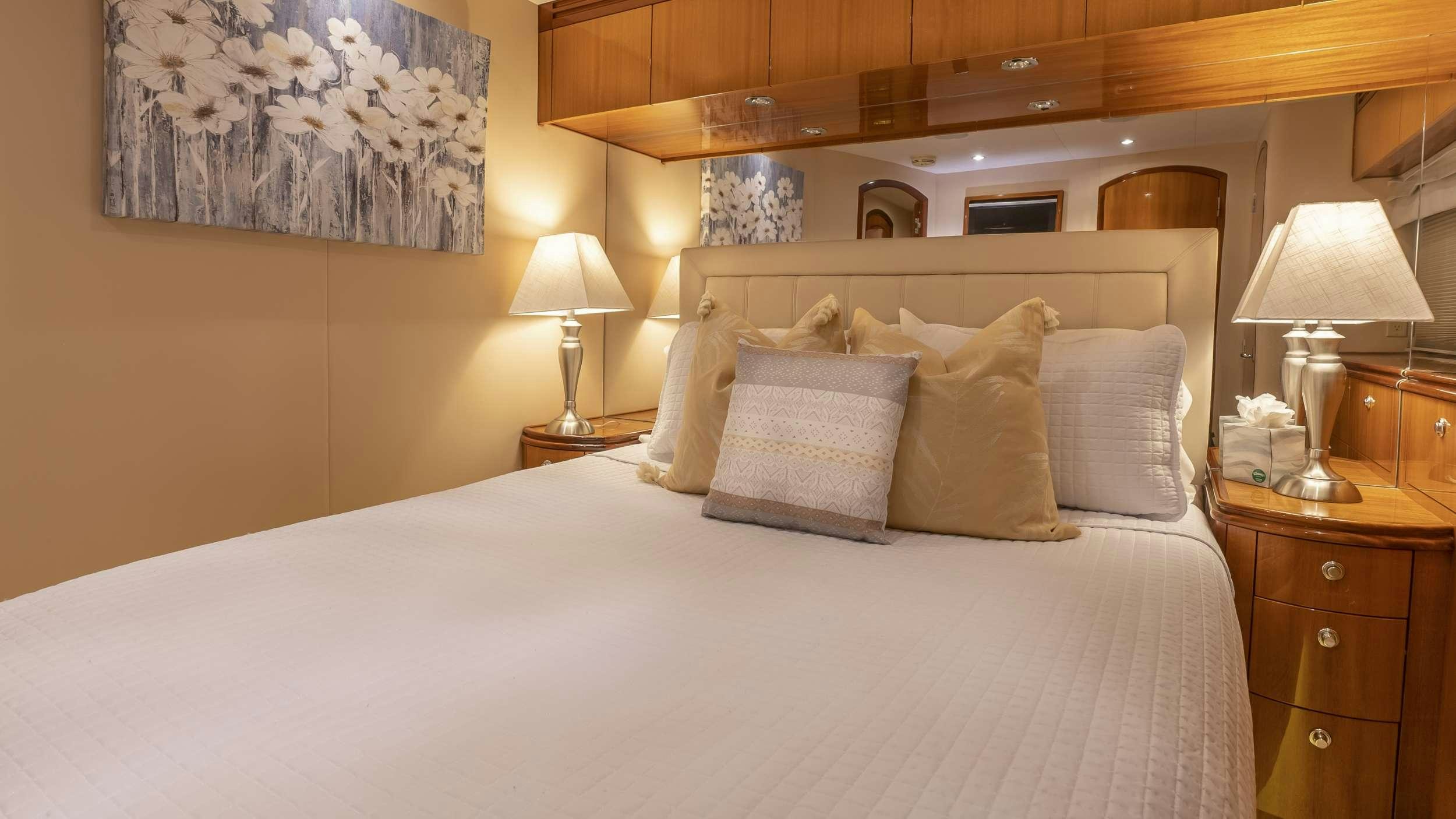 a bed with pillows aboard GALLOPIN Yacht for Charter