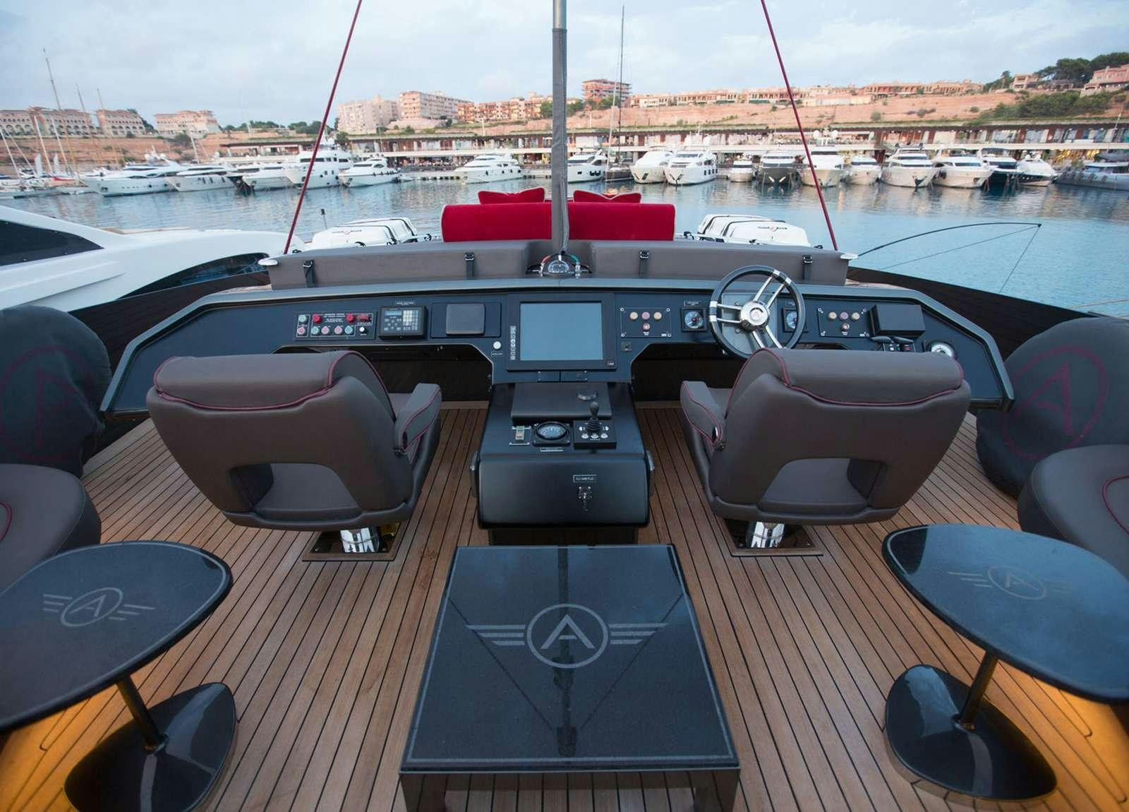 a table with a black tablecloth and a red cloth on it aboard SETTE Yacht for Charter