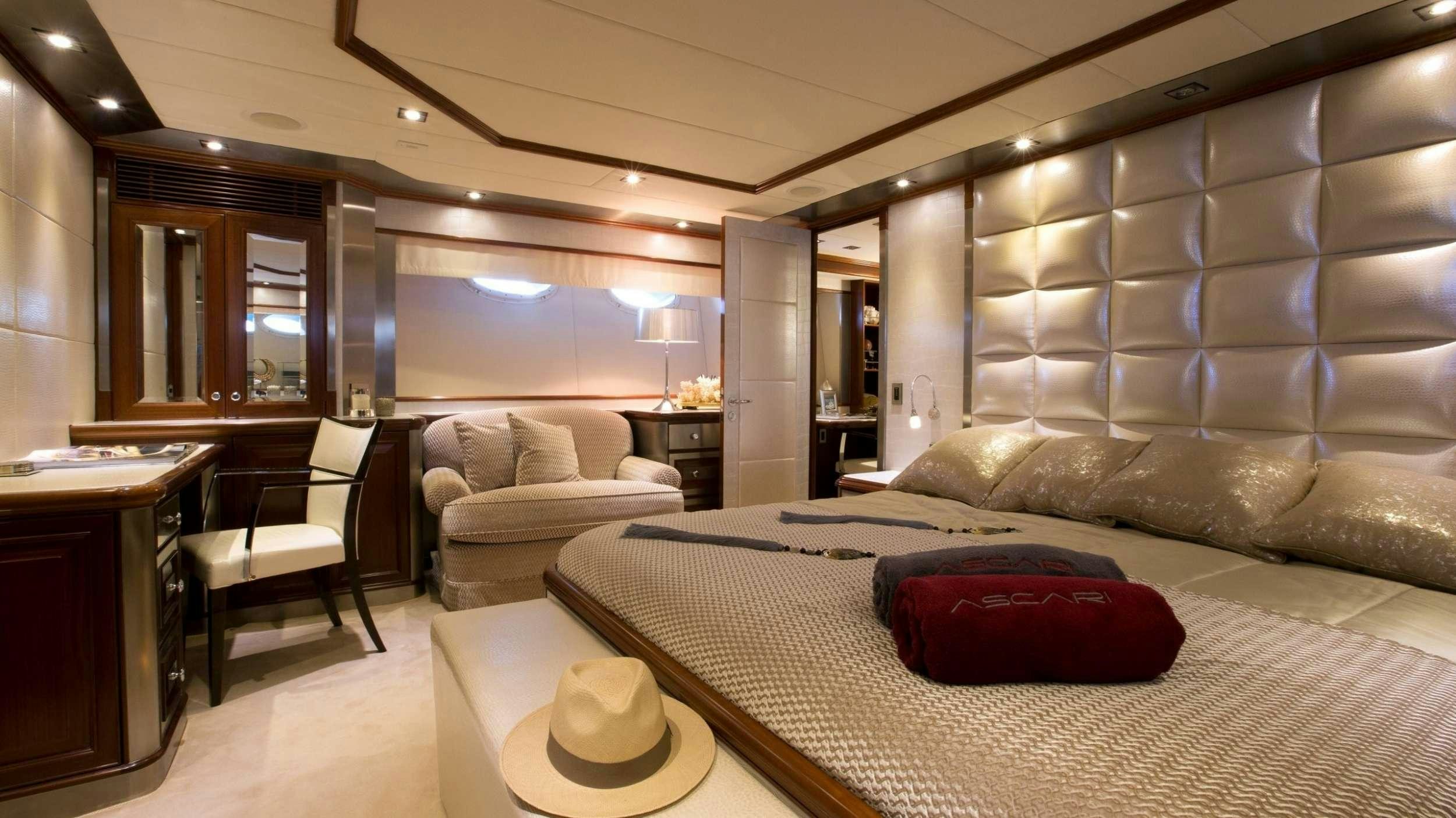 a large bedroom with a bed and a couch aboard SETTE Yacht for Charter