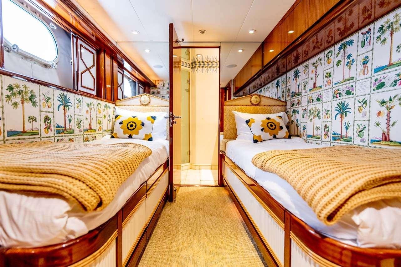 a couple of beds in a room aboard SUMMERTIME II Yacht for Charter