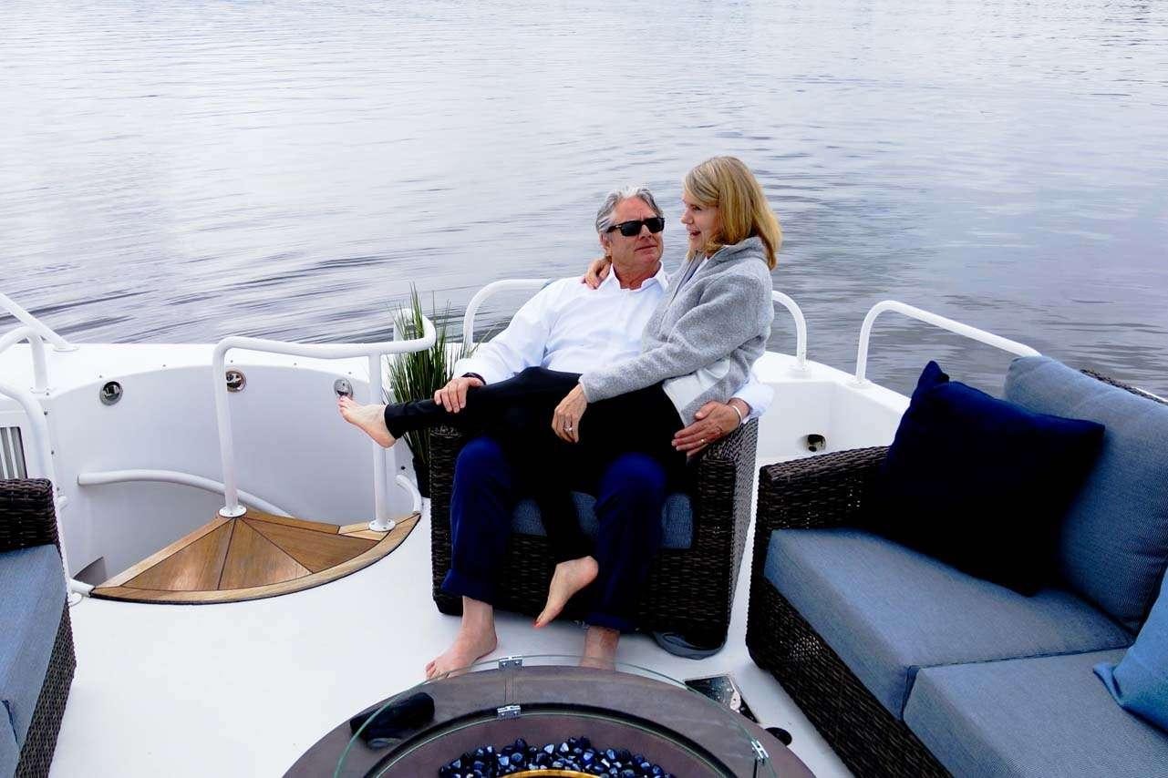 a man and woman on a boat aboard SUMMERTIME II Yacht for Charter