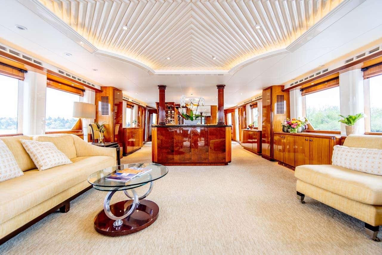 a living room with a couch and a coffee table aboard SUMMERTIME II Yacht for Charter