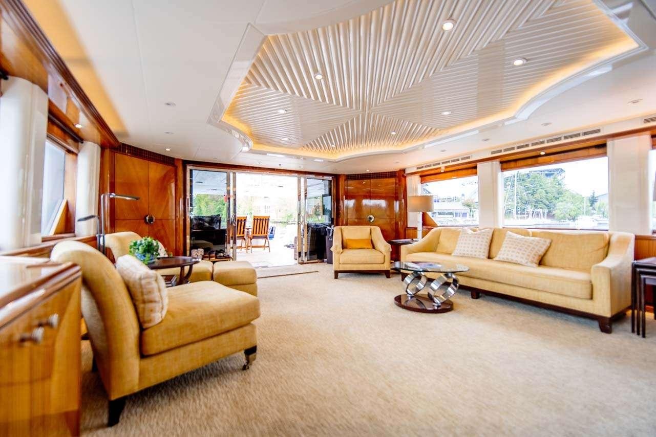 a living room with a large open window aboard SUMMERTIME II Yacht for Charter
