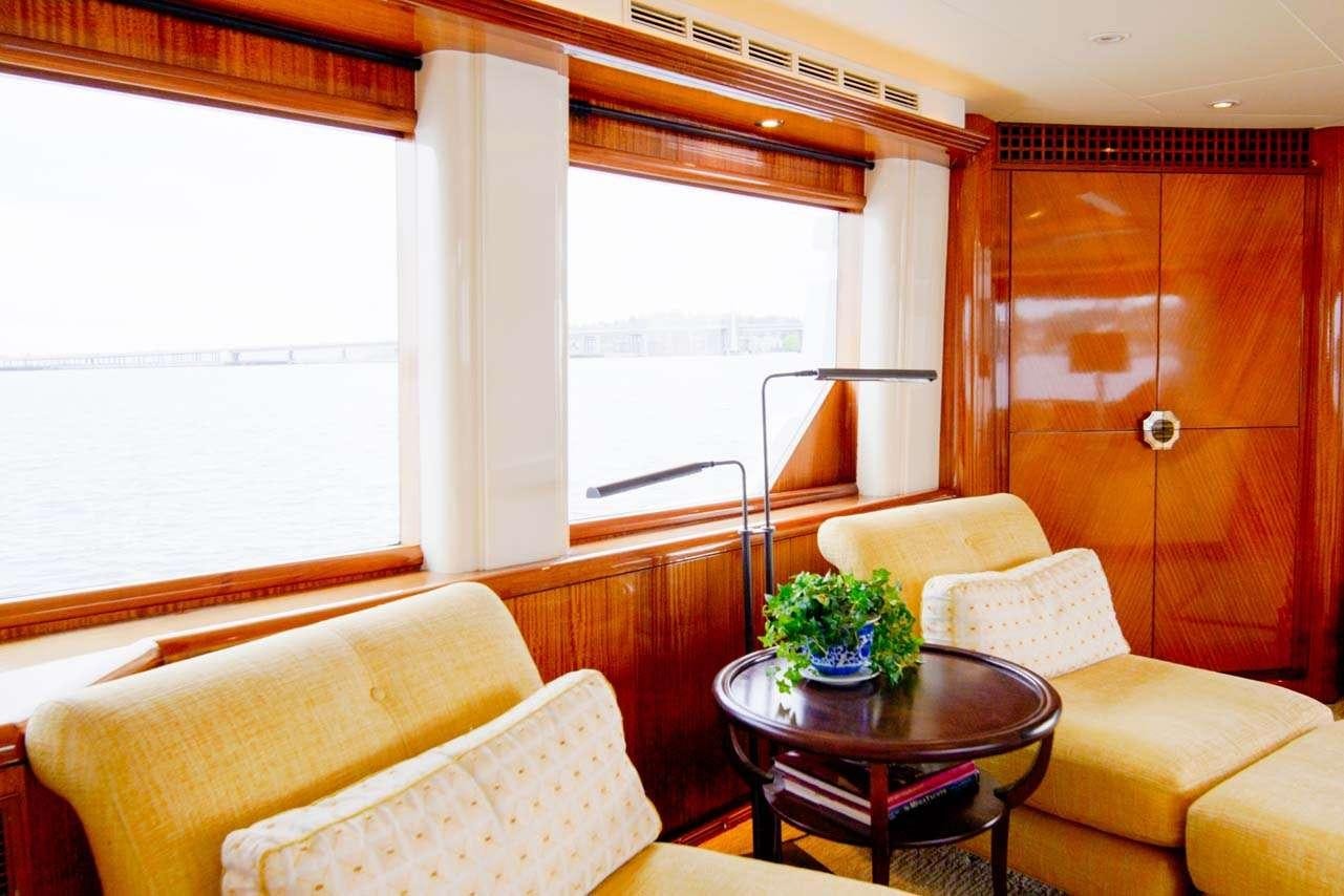 a living room with a wood cabinet aboard SUMMERTIME II Yacht for Charter