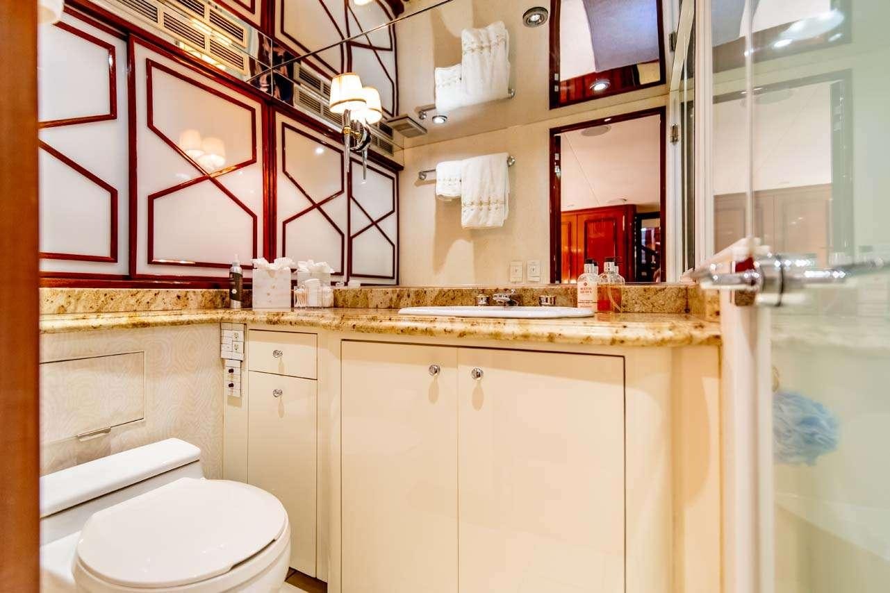 a bathroom with a sink and a toilet aboard SUMMERTIME II Yacht for Charter