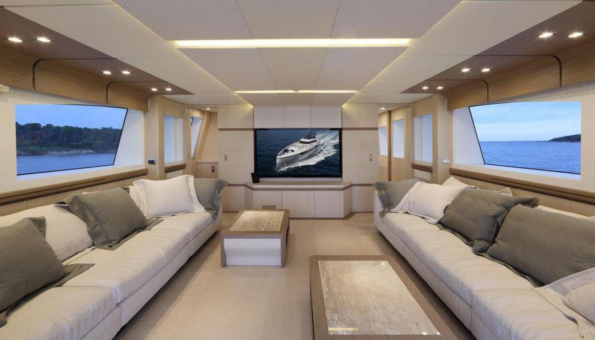 a living room with a large screen aboard LEUDIN I Yacht for Charter