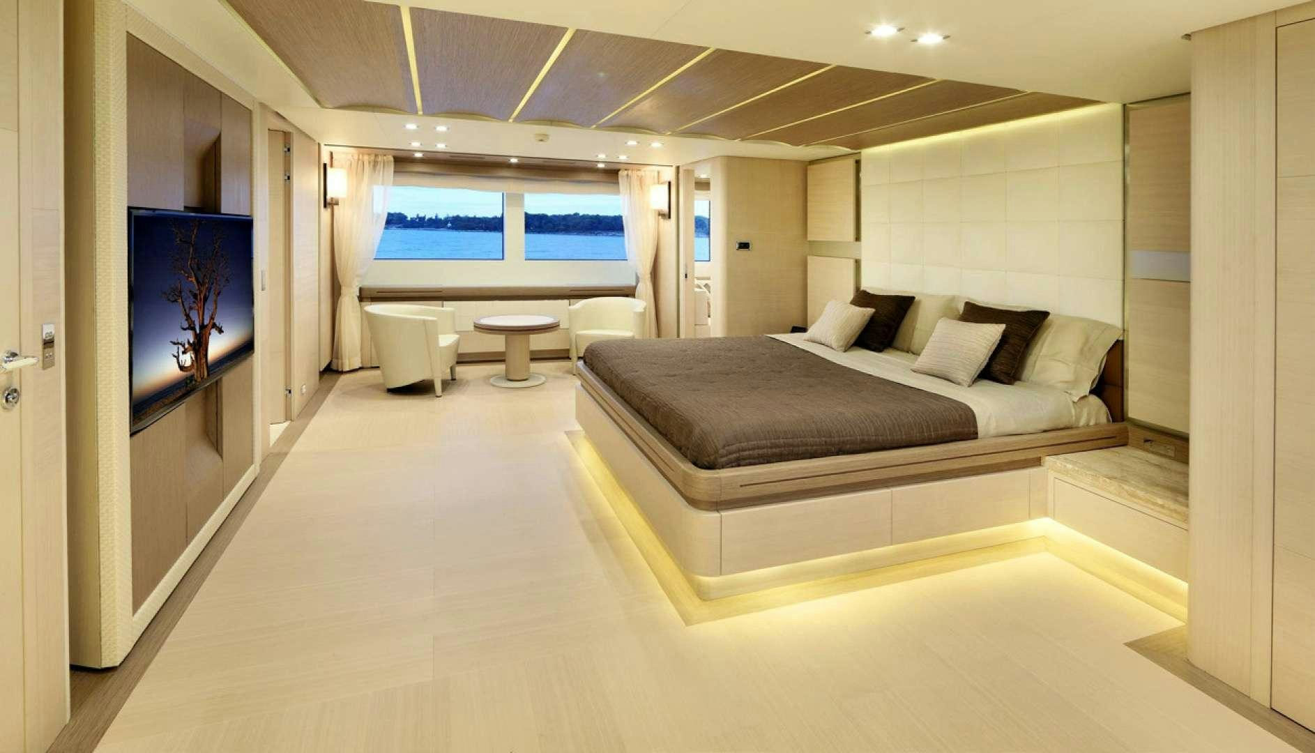 a large living room with a large window aboard LEUDIN I Yacht for Charter
