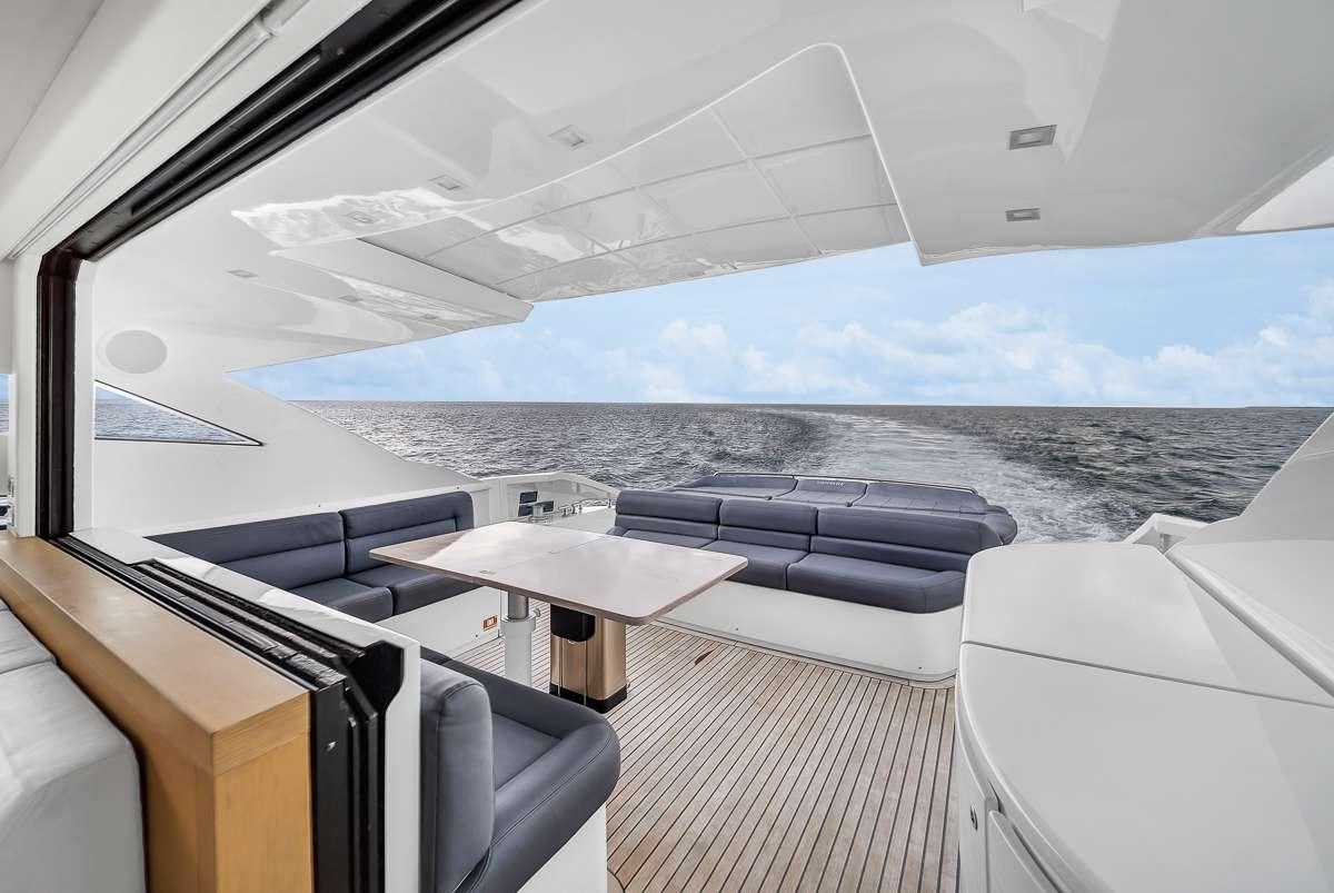 a boat with a view of the ocean and the land below aboard VANTAGE Yacht for Charter