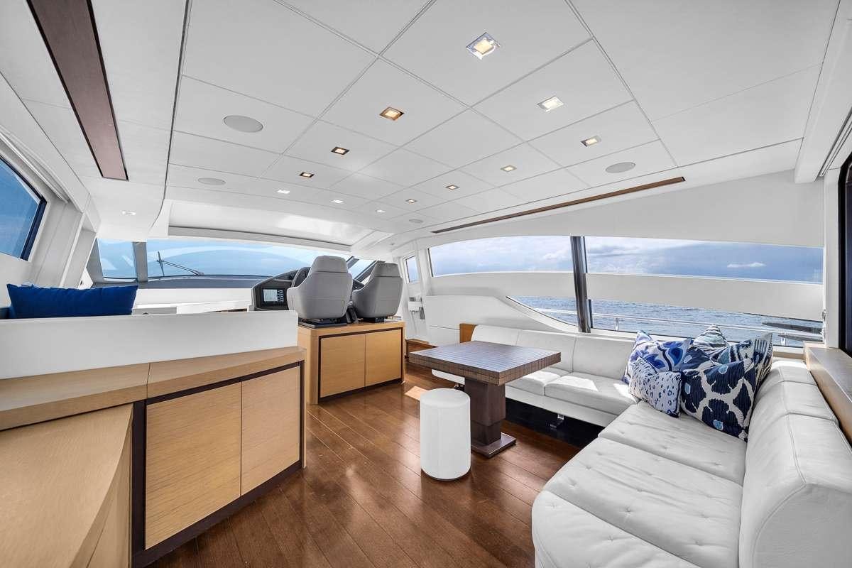a room with a view of the ocean and the deck aboard VANTAGE Yacht for Charter