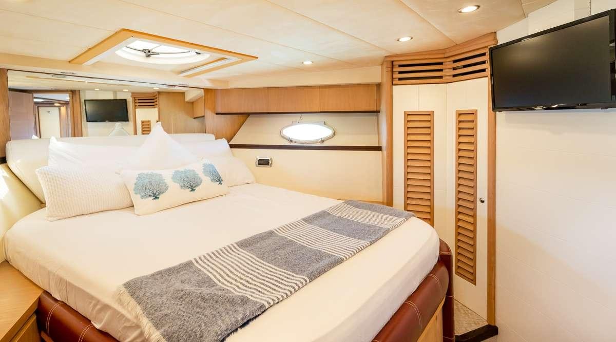 a bed in a room aboard DIVA Yacht for Charter