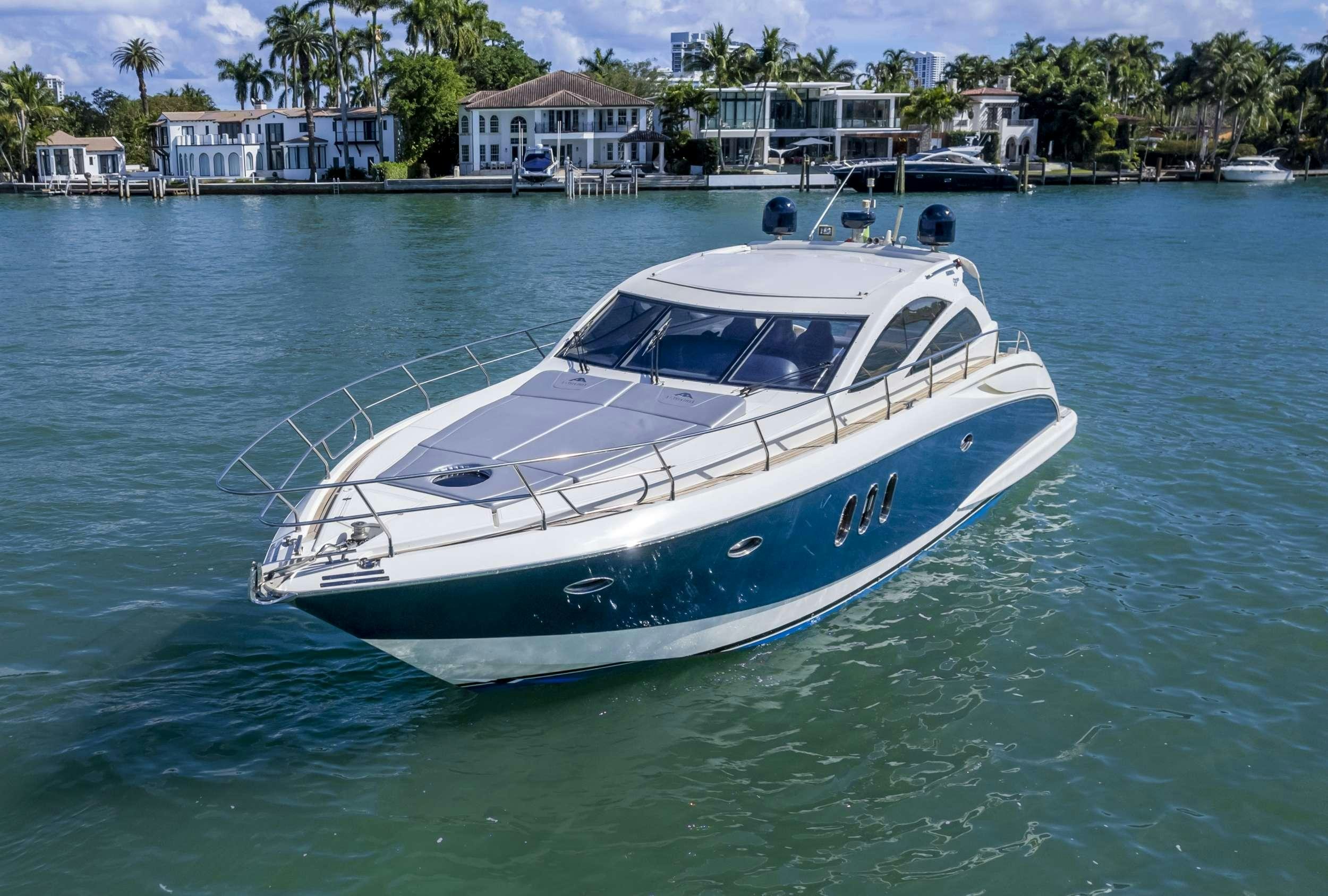a white boat in the water aboard DIVA Yacht for Charter