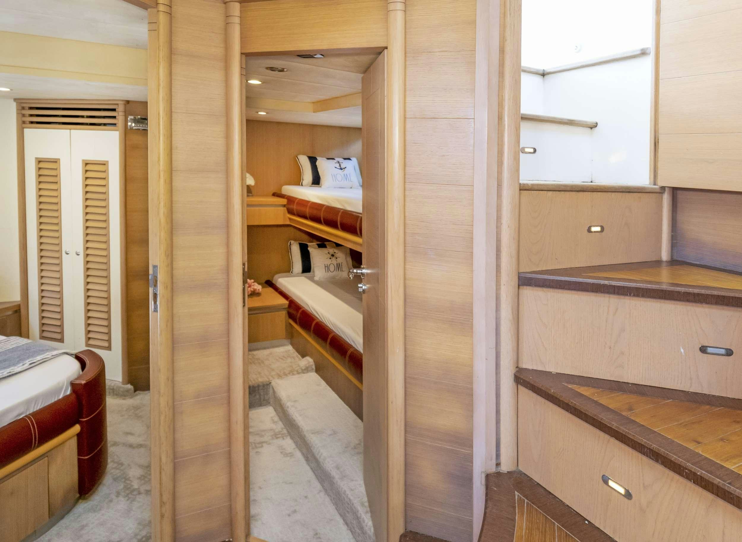 a room with wooden cabinets aboard DIVA Yacht for Charter