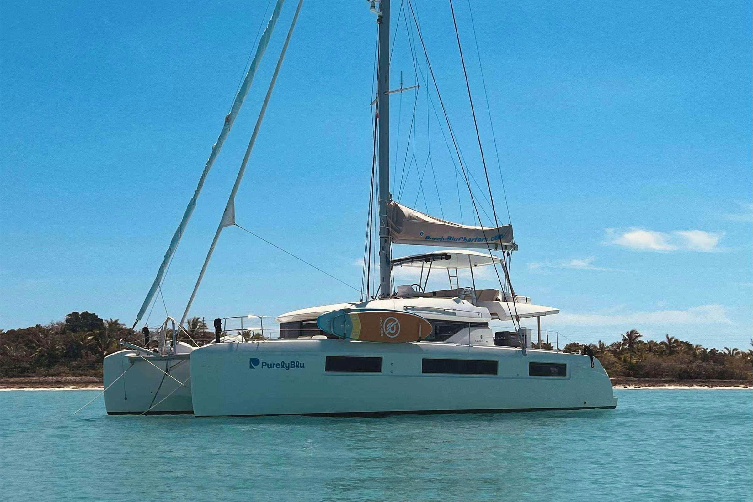 a white boat on the water aboard Purely Blu Yacht for Charter