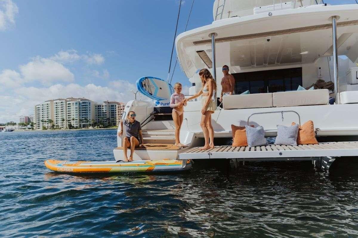 a group of people on a boat aboard Purely Blu Yacht for Charter