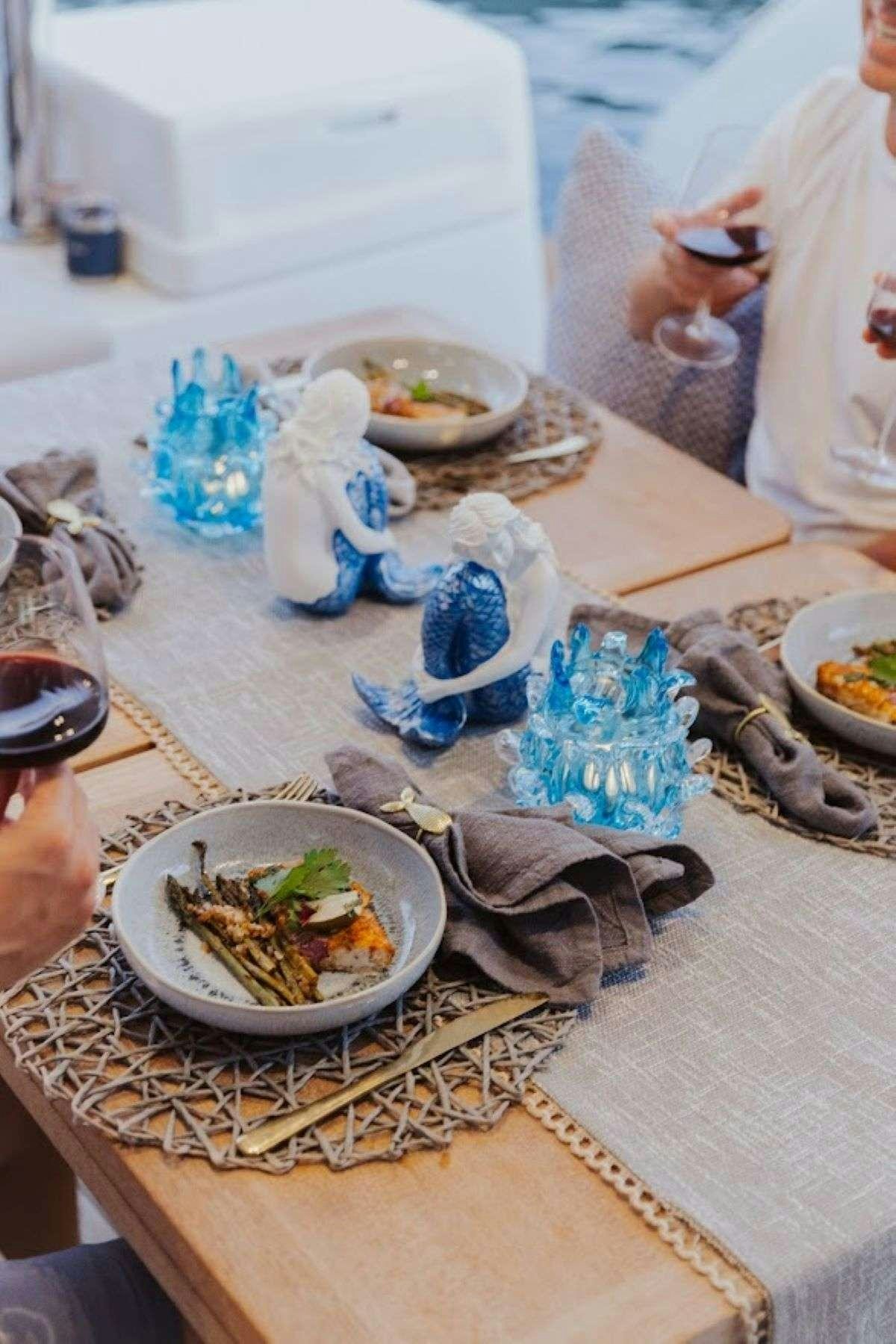 a table with food on it aboard Purely Blu Yacht for Charter