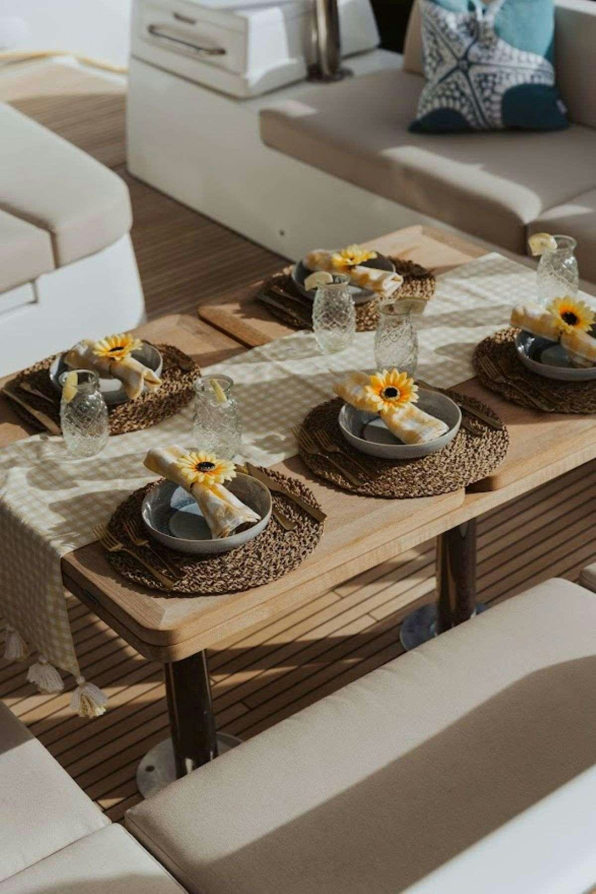a table with food on it aboard Purely Blu Yacht for Charter