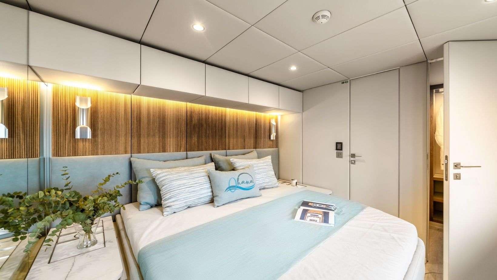 a bed in a room aboard OHANA Yacht for Charter