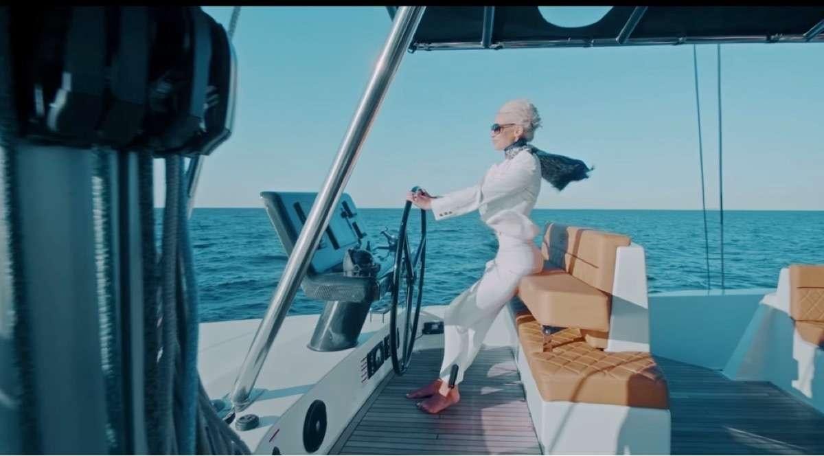 a person sitting on a boat aboard MOON DRAGON Yacht for Charter