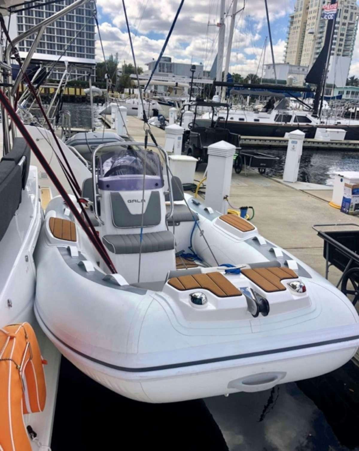 a boat in a harbor aboard MOON DRAGON Yacht for Charter