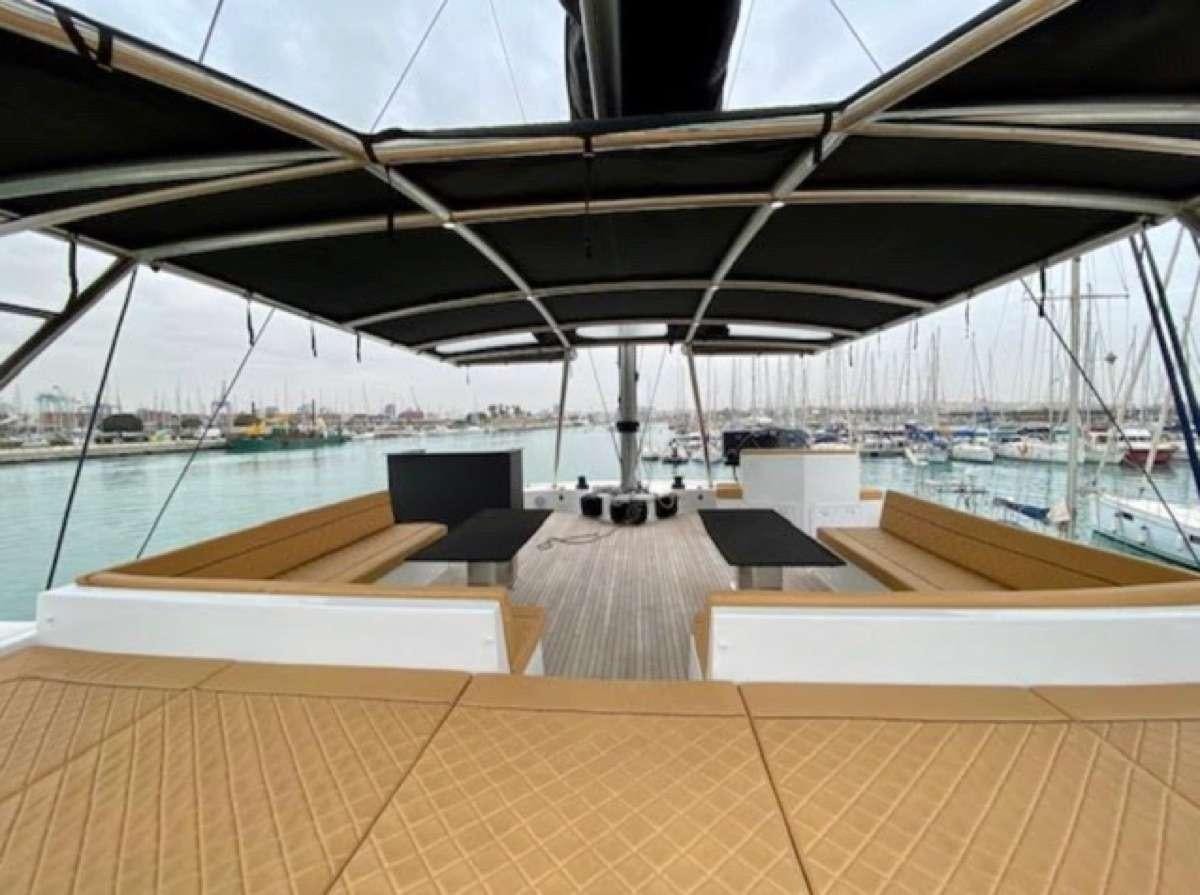 a large deck with a view of a city and water aboard MOON DRAGON Yacht for Charter