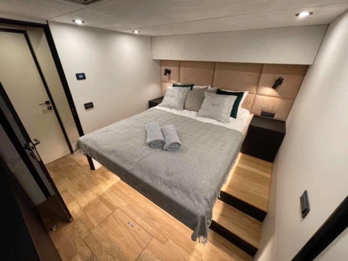 a bed in a room aboard MOON DRAGON Yacht for Charter