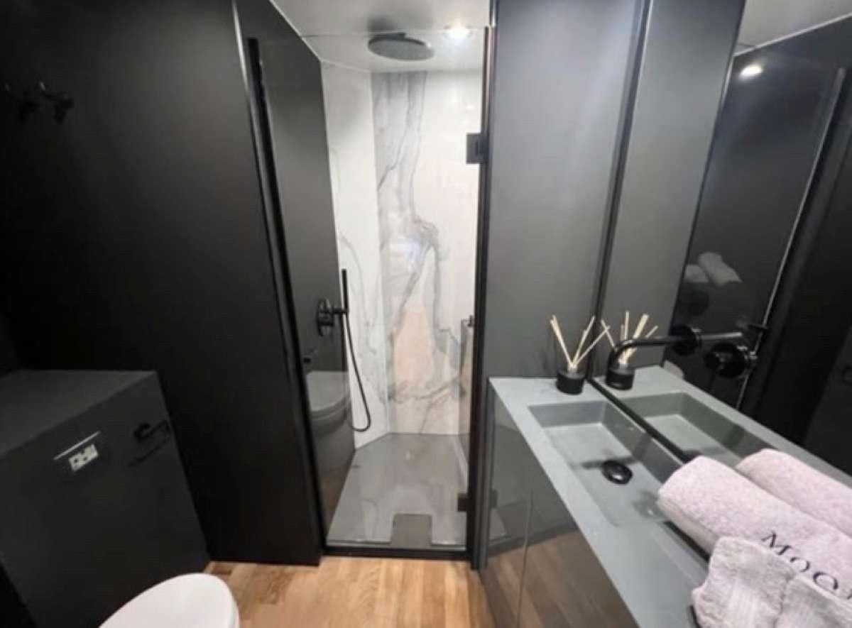 a bathroom with a large shower aboard MOON DRAGON Yacht for Charter