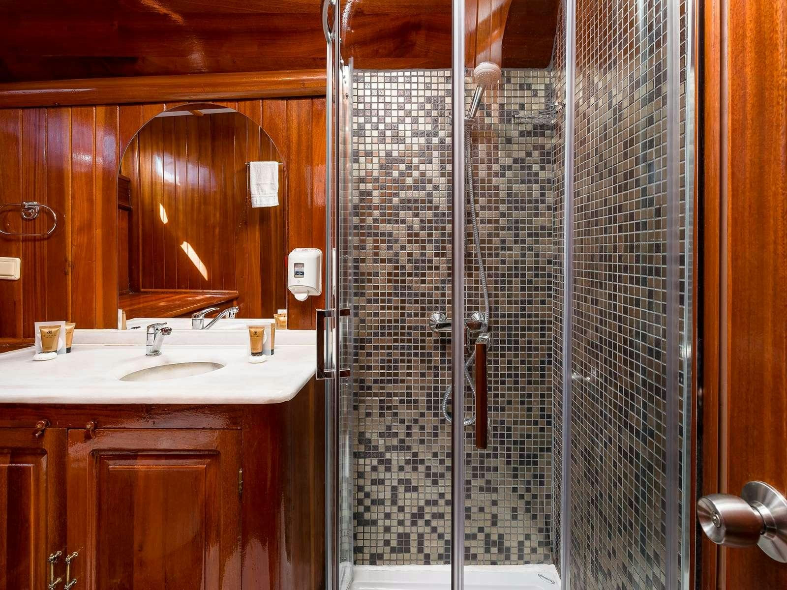 a bathroom with a shower and sink aboard GULET CROATIA Yacht for Charter