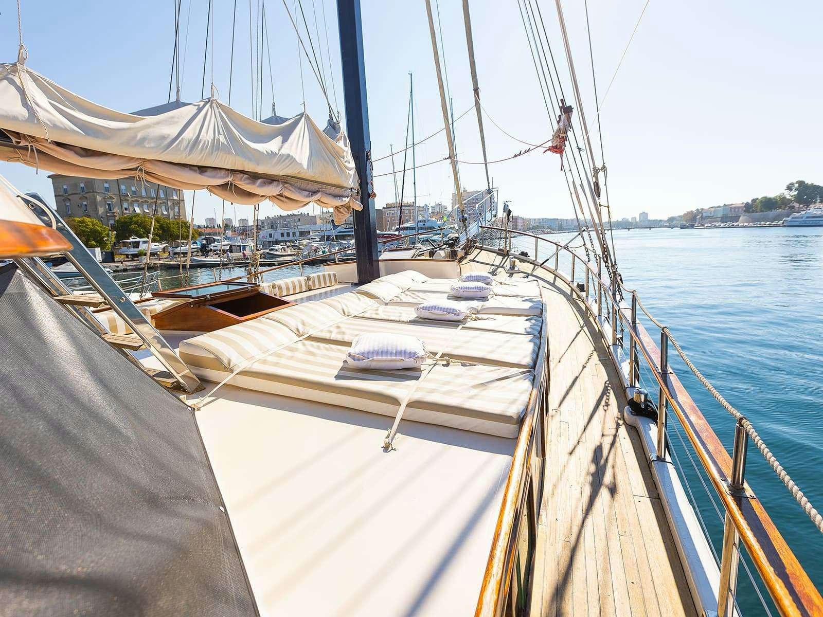 a boat is parked on the side of the water aboard Gulet Gardelin Yacht for Charter
